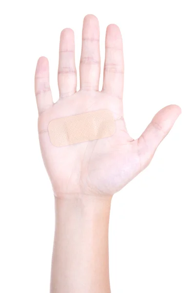 Bliska męskiej dłoni z medyczny klej patcha na białym tle na wh — Zdjęcie stockowe
