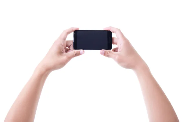 Hombre de las manos sosteniendo el teléfono móvil inteligente con pantalla en blanco aislada —  Fotos de Stock