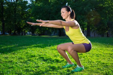 beautiful woman working out in park clipart