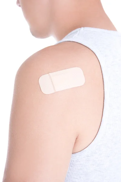 Medical adhesive plaster on male shoulder isolated on white — Stock Photo, Image