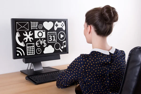 Back view of young beautiful business woman using pc with multim — Stock Photo, Image