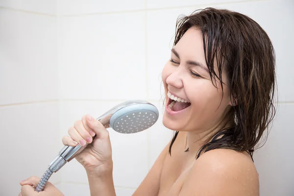 Portrait of happy woman singing in shower — Stock Photo, Image