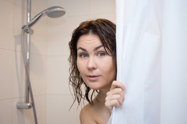 cute scared woman hiding behind shower curtain clipart