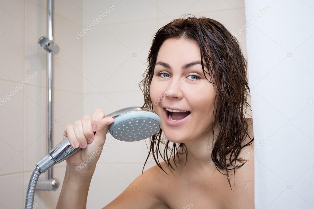 portrait of young woman singing in shower