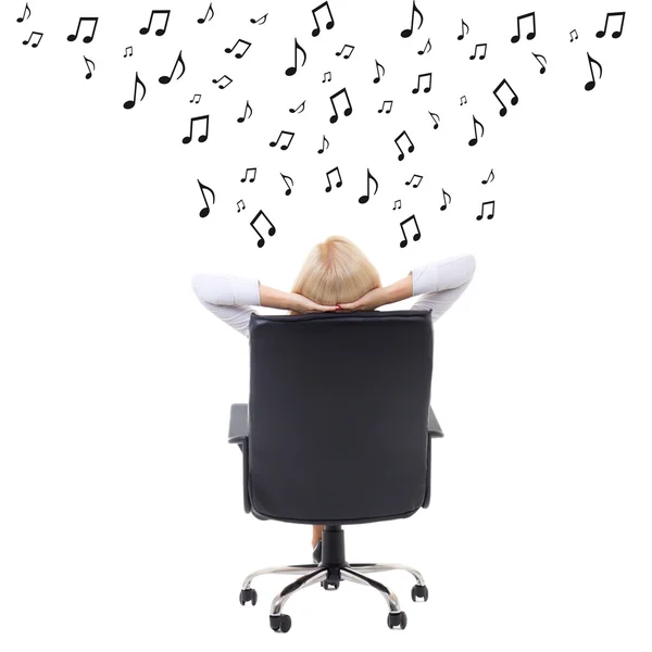 Back view of woman with hands crossed behind her head sitting on — Stock Photo, Image