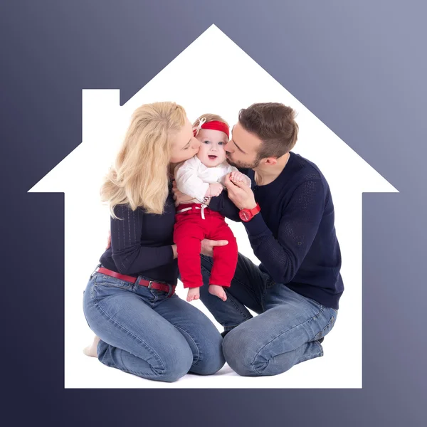 Family concept - father and mother kissing little daughter in ho — Stock Photo, Image