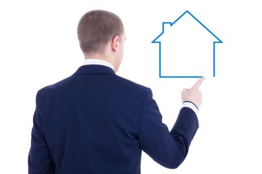 real estate concept - back view of young business man drawing ho