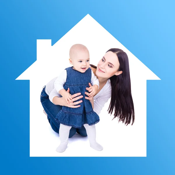 Home concept - young mother playing with baby girl — Foto de Stock