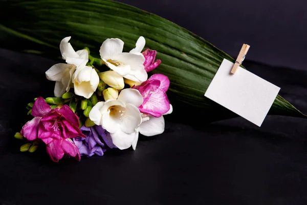 Bouquet of freesia and card — Stock Photo, Image