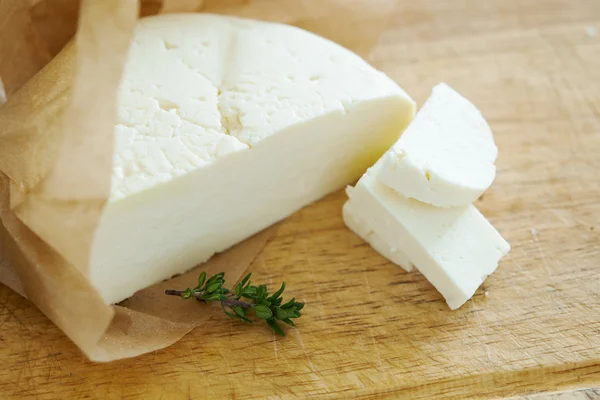 Feta cheese on wooden background — Stock Photo, Image