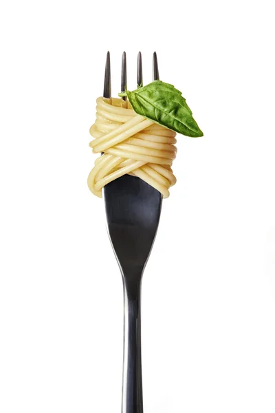 Spaghetti and basil on a fork — Stock Photo, Image