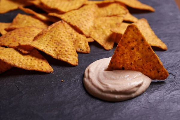 Nachos chips and dip sauce — Stock Photo, Image
