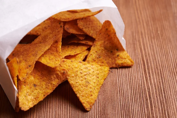 Tortilla chips on wooden background — Stock Photo, Image