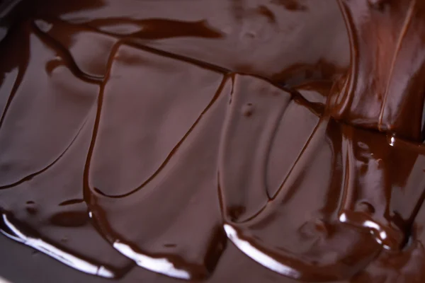 Ciemnym tle czekolady — Zdjęcie stockowe