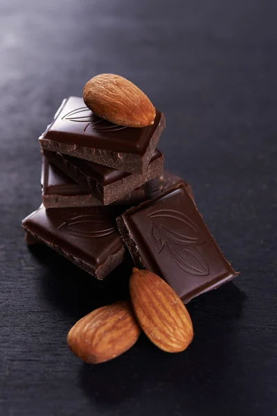 Dark chocolate and almonds nuts — Stock Photo, Image