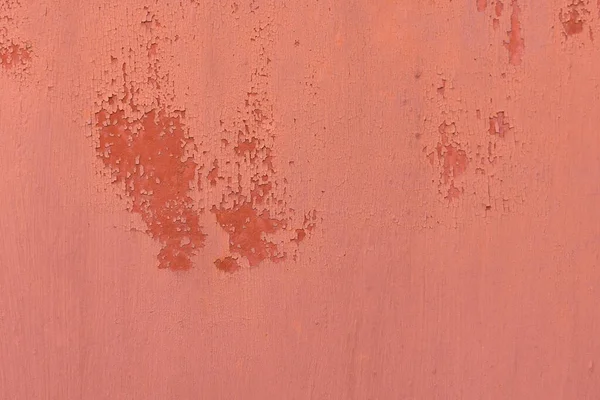 Texture in red. Matte surface. There is a patch on the texture, old texture with damaged paint.