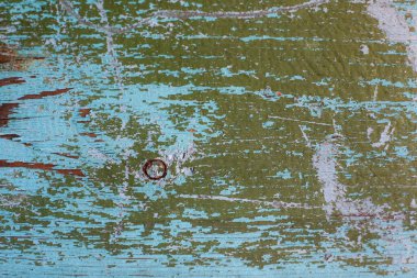 Eski doku ve hasarlı boya. Boya lekeleri olan doku, zamandan ve yaşlılıktan kalma çatlak maddeler. Doku yeşile dönmüş. Matte yüzeyi. 