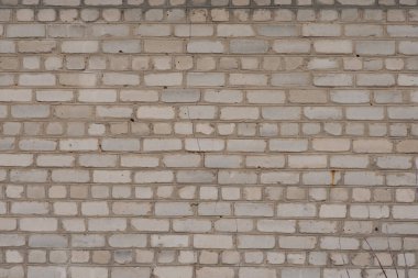 Beyaz tuğlalı duvar. Yatay fotoğraf. Eski binanın duvarı..