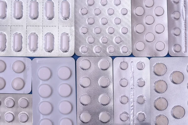 Envases de ampollas de medicamentos de cerca. Antecedentes de pastillas. — Foto de Stock