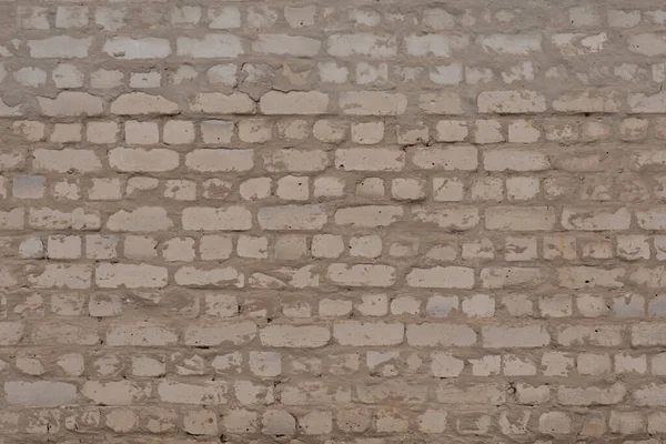Uma parede de tijolo feita aproximadamente por um construtor inepto. — Fotografia de Stock