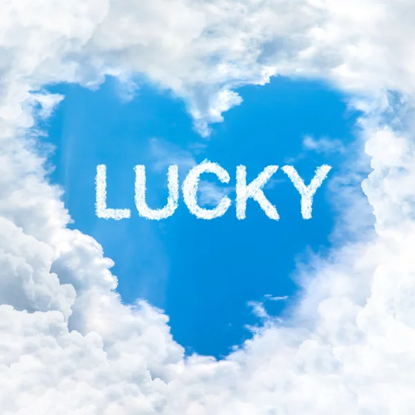 Mavi gökyüzü üzerinde şanslı kelime — Stok fotoğraf