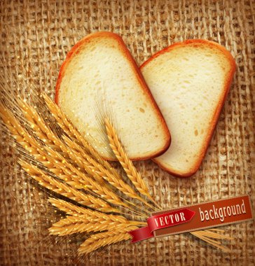 Dilimlenmiş ekmek ve buğday kulaklar