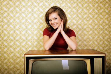 Young charming woman staing at room with vintage wallpaper and retro TV set, retro stylization 60-70s, image toned clipart