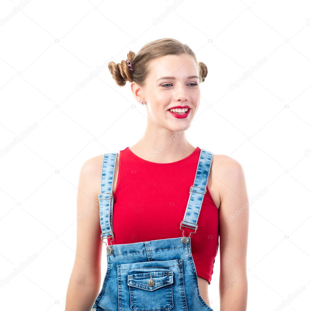 Pretty funny emotional teen girl, portrait over white background. Beautiful woman wearing red top and blue jeans. Young charming lady with blue eyes and blond hair