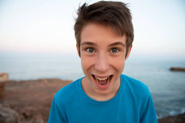 Funny Young Happy Teen Boy Makes Faces Open Mouth Beach — Stock Photo, Image