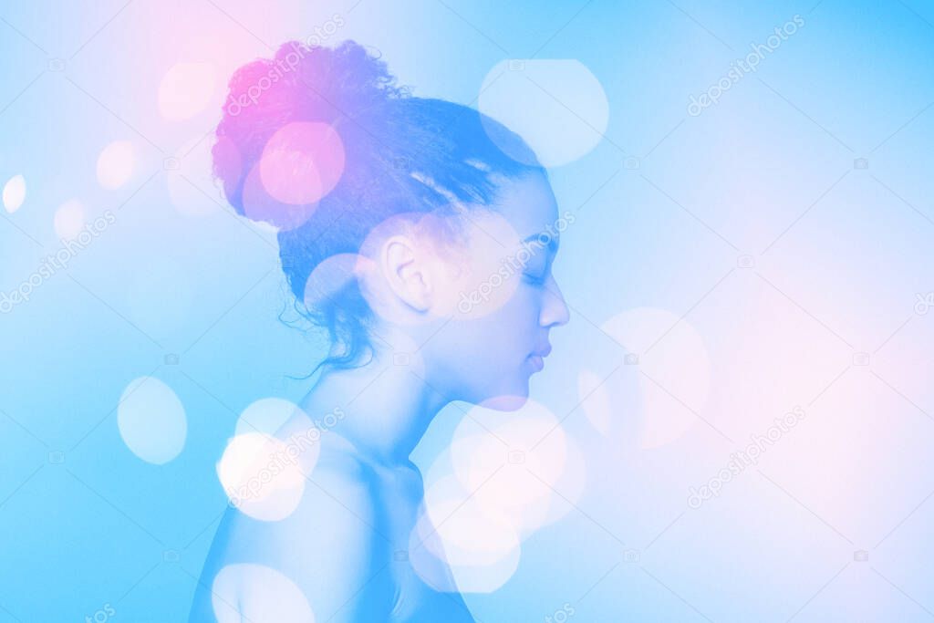 Double exposure portrait of young beautiful african american woman and bokeh lights, modern art 