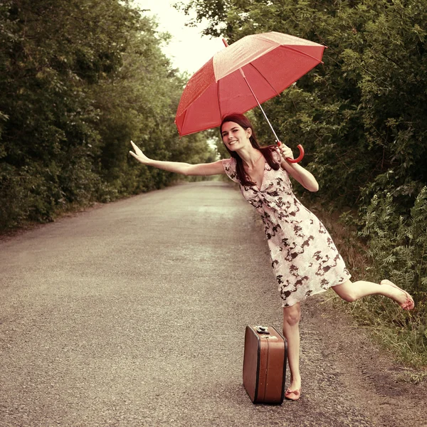 Young woman hitchhiking — Stock Photo, Image