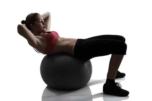 Woman shake the press with fitness ball — Stock Photo, Image