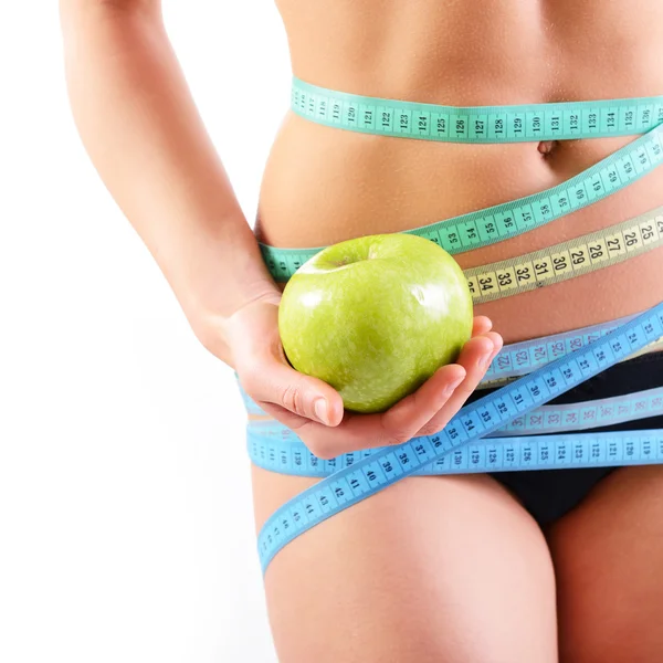 Woman holding green apple — Stock Photo, Image