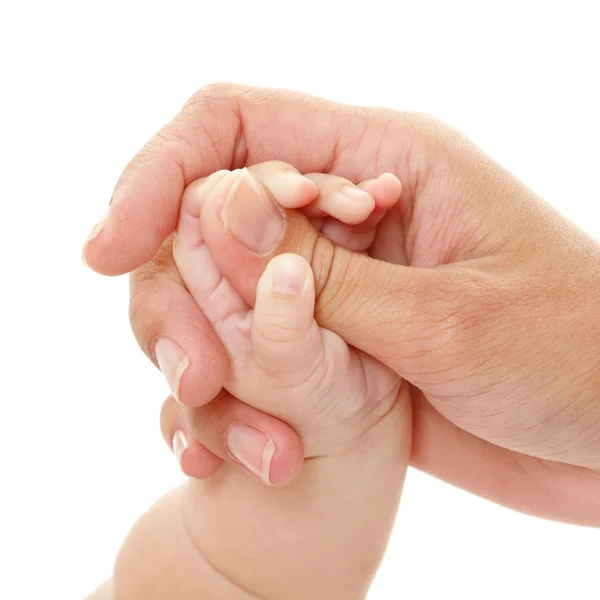 Baby har mors hand, — Stockfoto