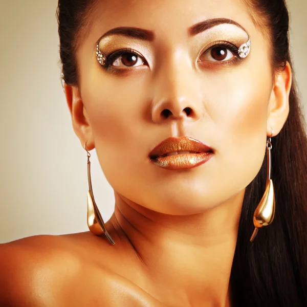 Young  woman with golden makeup — Stock Photo, Image