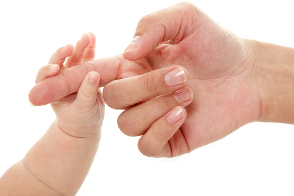 Baby holds mother's finger hand — Stock Photo, Image