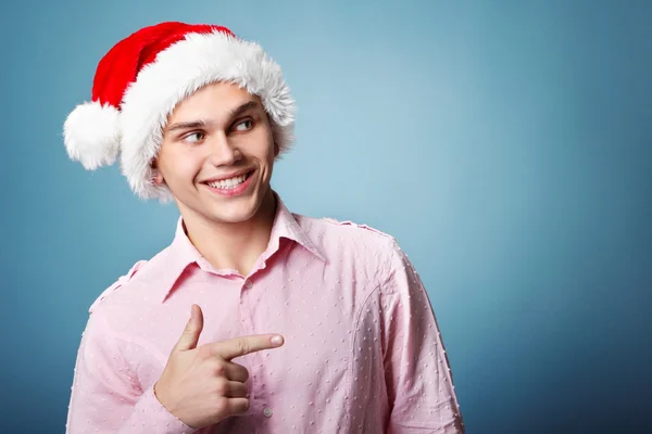 Christmas man  point with hand left — Stock Photo, Image
