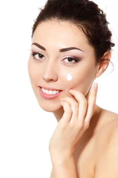 Woman applying ceam on face — Stock Photo, Image