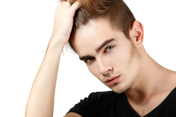 Joven guapo tocándose el pelo — Foto de Stock