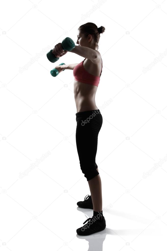 woman doing exercise with dumbbells