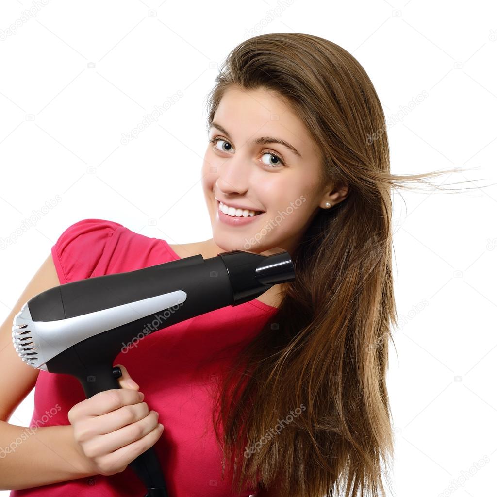 Girl blows dry hair