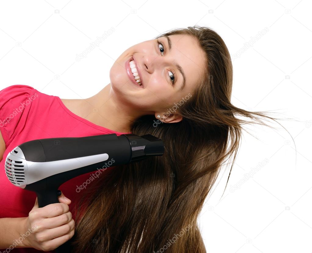 Girl blows dry hair