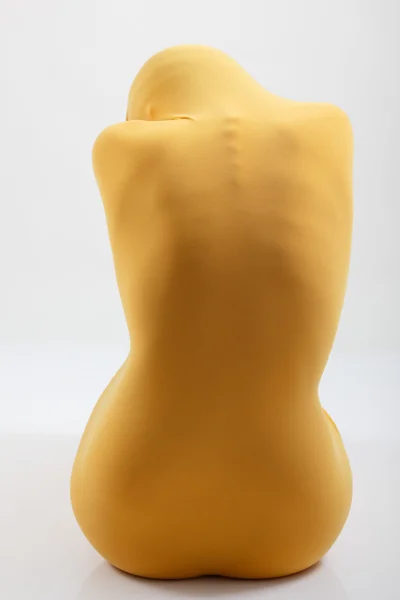 Perfect sexy female body in yellow fabric — Stock Photo, Image
