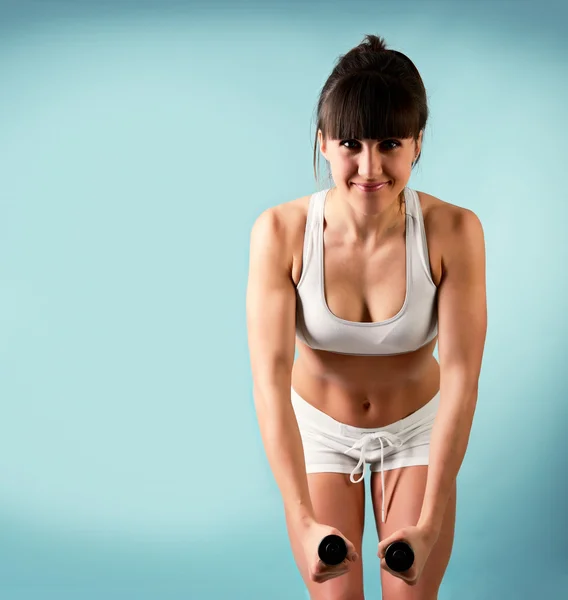 Girl   with dumbbells — Stock Photo, Image