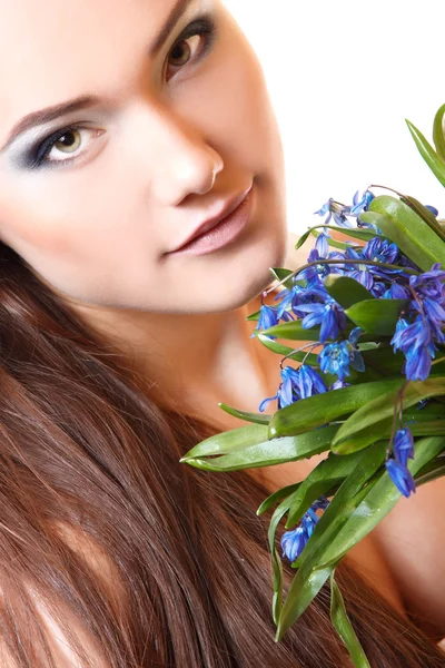 Teen girl smell snowdrop flowers — Stock Photo, Image