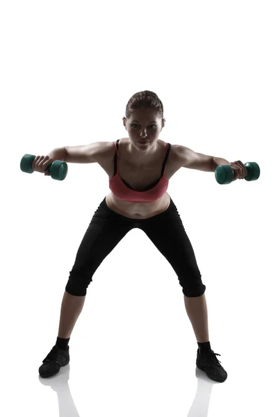 Woman doing exercise with dumbbells — Stock Photo, Image