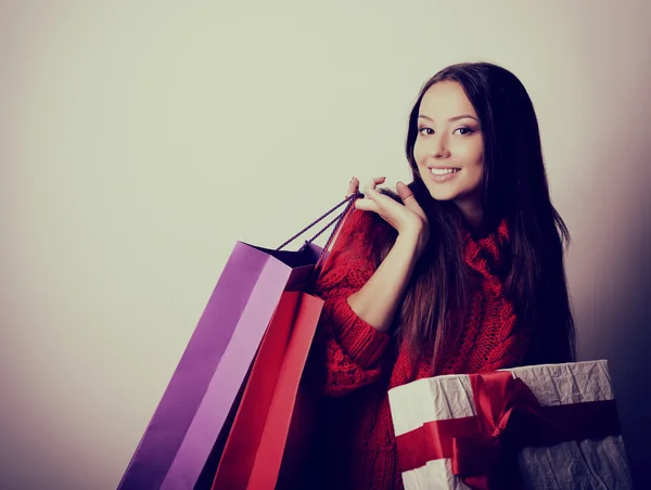 Woman holding colored shopping bags — Stock Photo, Image