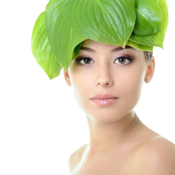 Cheerful woman with green leaves — Stock Photo, Image