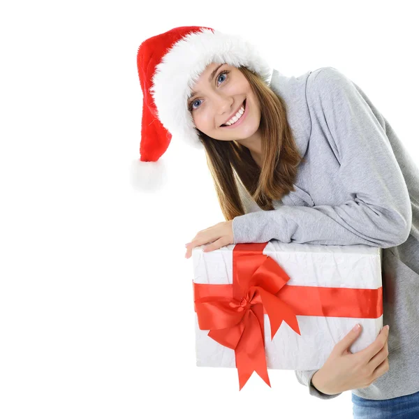 Fille dans le chapeau du Père Noël tenant cadeau — Photo