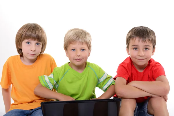 Portrait of smart schoolboys with laptop — Stock Photo, Image